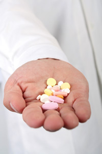 Hand holding pills